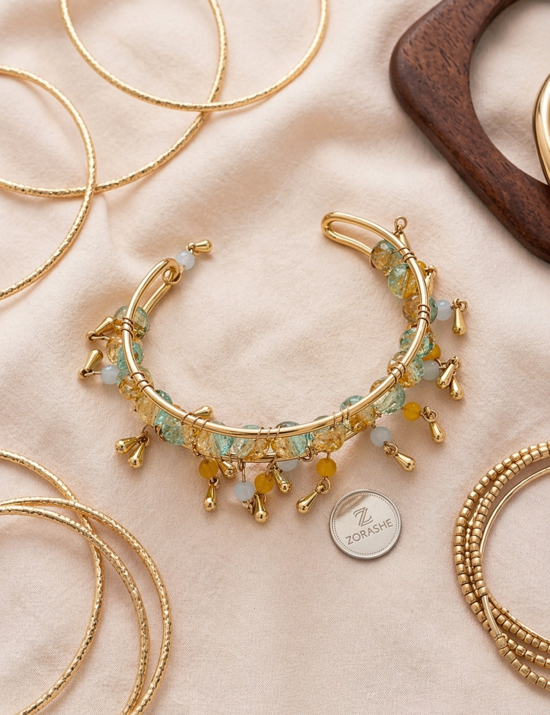 Multicoloredglassblueandgoldtasselopenbracelet_1.png